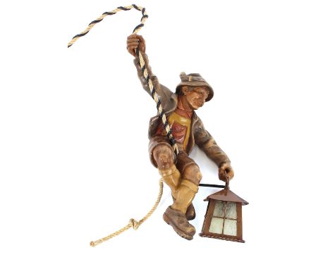 A Black Forest style figural hanging lamp