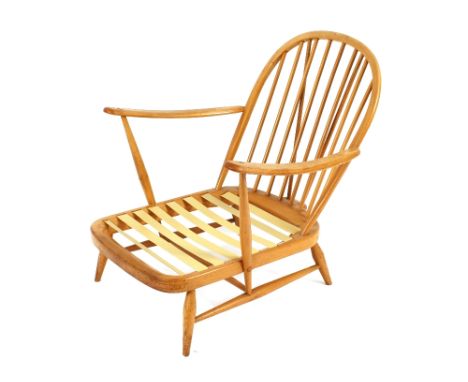 A light Ercol stick back deep seated armchair