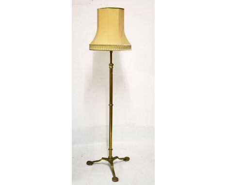 Early 20th Century brass adjustable standard lamp with tubular stem on tripod support   Condition: 
