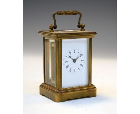 Small French brass cased carriage clock, the white enamel dial with Roman numerals   Condition: 