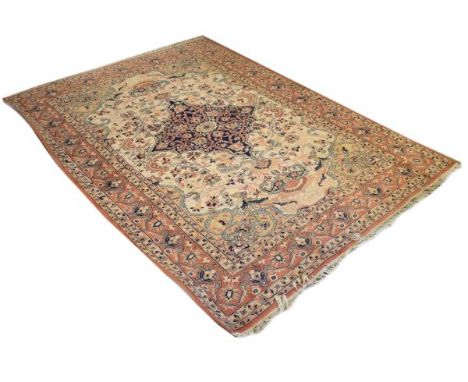 Modern Middle Eastern style carpet decorated with a central medallion on a light brown ground within multi borders, 362cm x 2