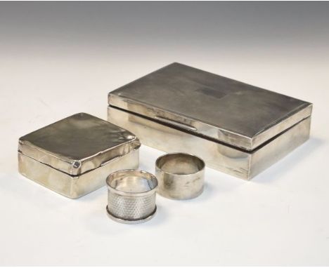 George V engine turned silver box, Sheffield 1935, a smaller silver box with worn hallmarks and two George V silver napkin ri