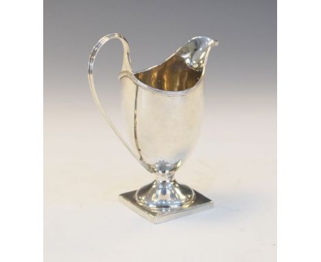 George III silver helmet shaped cream jug having a high loop handle and standing on a square foot, London 1795, 2.6oz approx 