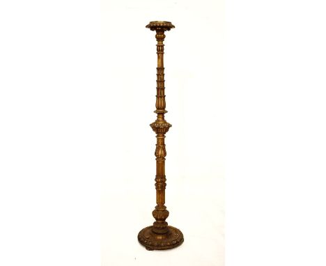 Carved giltwood torchère or lamp standard having a carved and reeded pillar and standing on a circular base   Condition: 