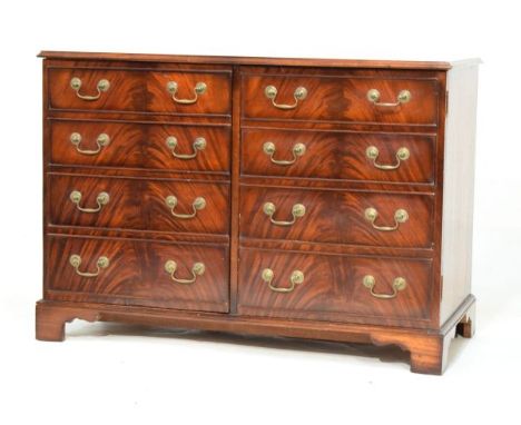 Reproduction mahogany two door cabinet with moulded rectangular top over a pair of cupboard doors, each formed as four cockbe