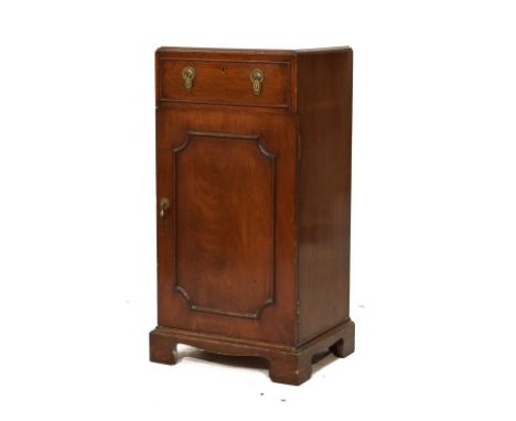 Early 20th Century mahogany bedside cabinet, the moulded rectangular top over single frieze drawer and panelled cupboard encl