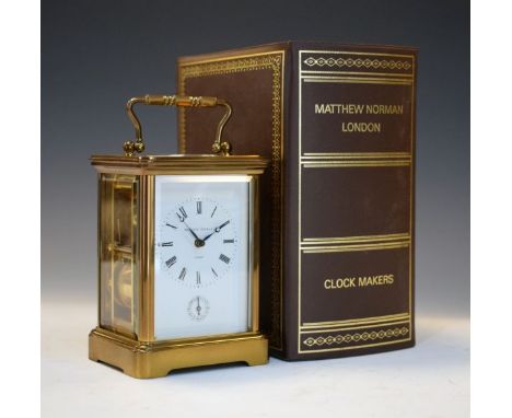Matthew Norman brass cased carriage clock, white enamel dial with Roman numerals and subsidiary dial, striking movement, boxe