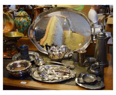 Selection of silver plated and pewter wares to include; oval galleried two handled tray, ladle, pair of bottle coasters or de