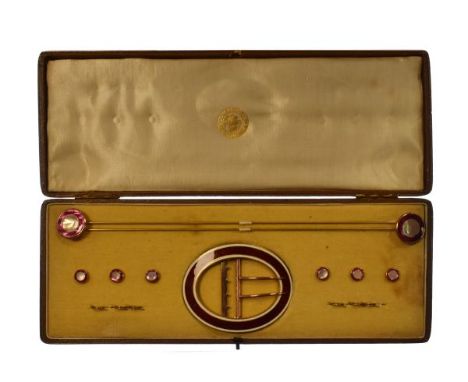 Suite of enamel set accessories comprising: oval buckle, pair of hat pins and six studs, in fitted box   Condition: 