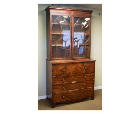 Early 19th Century mahogany secretaire bookcase, the upper stage with cavetto moulded top over a pair of lancet tracery doors