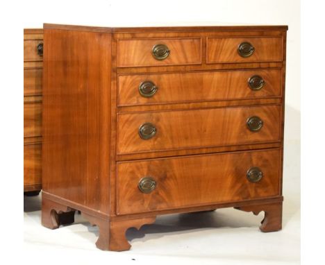 Reproduction Georgian style mahogany chest of two short and three long drawers, standing on bracket feet   Condition: 