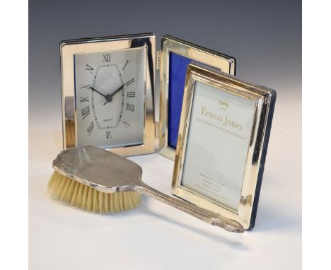 Elizabeth II silver picture frame, Sheffield 2000, a silver backed hair brush, Birmingham 1958 and a silver plated picture fr