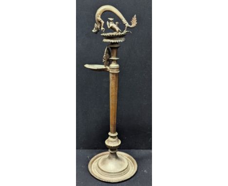 A 19th century Indian or Nepalese Hindu brass floor standing lamp with Ganesh