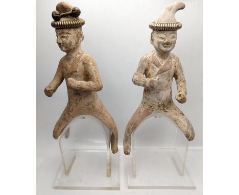 A pair of Tang Dynasty style terracotta horseback riders, circa 20th century, raised on stand, H.45cm