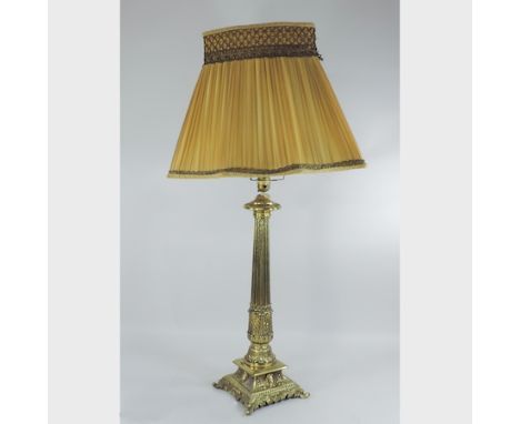 An ornate brass table lamp and shade, 86cm tall overall