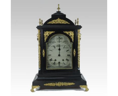 A 19th century ebonised and gilt mounted bracket clock, the case with an arched top, flanked by pierced side below carrying h