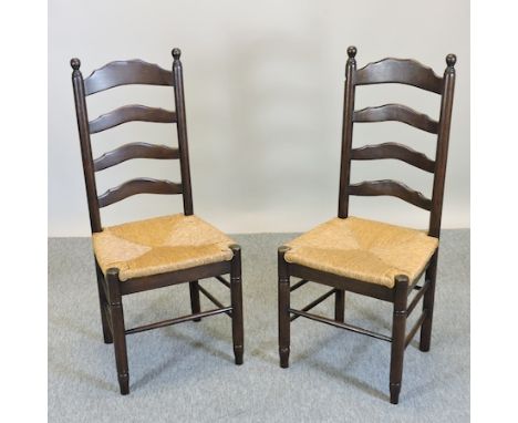 A set of six ladder back rush seated dining chairs