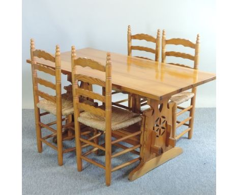 A pine kitchen table, 150 x 74cm, together with a set of four ladder back dining chairs