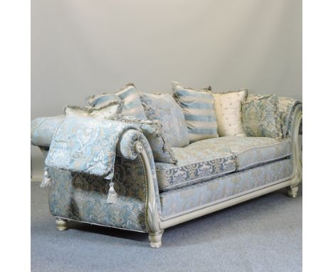 A large blue and gold upholstered three seater sofa, with loose cushions, 235cm 