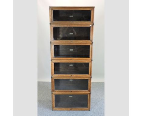 An early 20th century oak Globe Wernicke glazed five tier sectional bookcase, 74cm