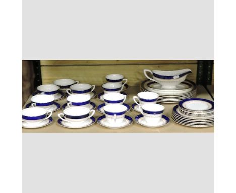 A collection of Royal Worcester Regency pattern blue and gilt decorated tea and dinner wares