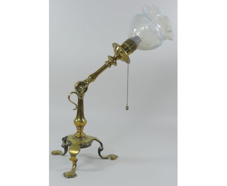 An Arts and Crafts brass angle poise table lamp, in the manner of W.A.S. Benson, stamped OSLER, with a frilled vaseline glass