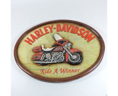 A Harley Davidson oval painted wooden plaque, 56cm wide