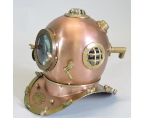 A metal diver's helmet, inscribed 'anchor engineering', 45cm tall 