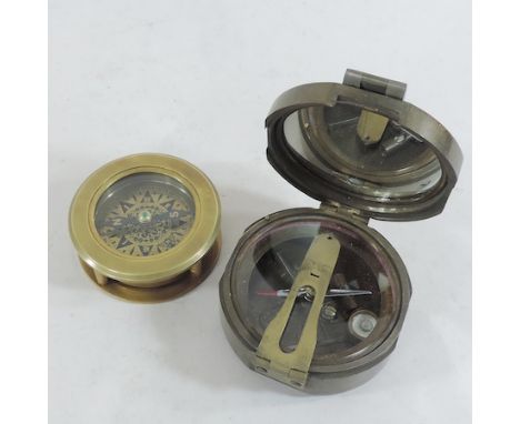 A brass Brunton compass, together with another compass