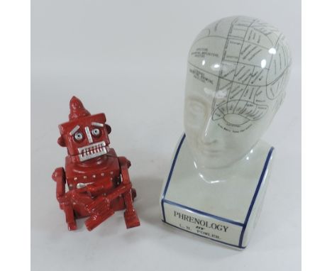 A pottery phrenology head, 28cm tall, together with a cast iron robot money box 