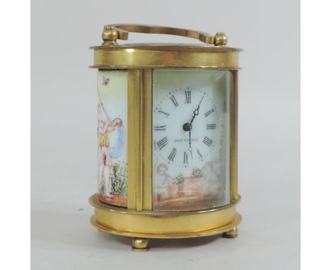 A brass cased oval carriage clock, with painted decoration, 