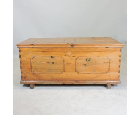 A large Victorian pine trunk, with a hinged lid, 129cm