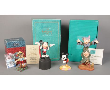 A small collection of Walt Disney figures from the 'Classics' and 'Showcase' collections. To include Mickey Conductor, Snow W