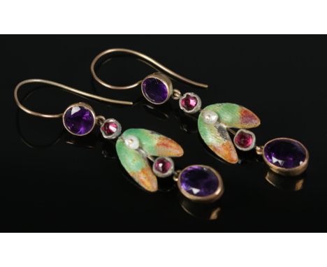 A pair of yellow and white metal earrings with enamel decoration and amethyst coloured stones. 3.85g.  