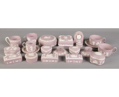 A good collection of Wedgwood Lilac Jasperware. To include large lidded trinket dishes, cups and saucer, quartz clock, candle