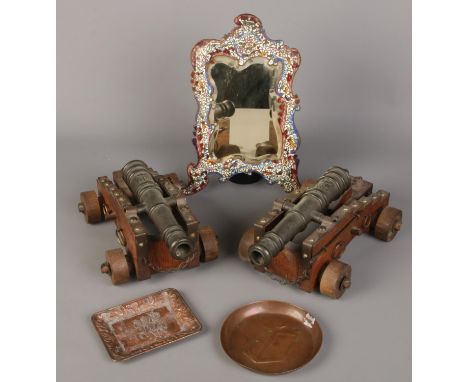 A small quantity of metalwares. Including enamel bevel edge mirror, pair of desk cannons and two copper dishes.  Mirror missi