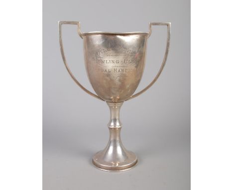 A twin handled trophy presented to Otley Mills Bowling Club for the Annual Handicap. Assayed Birmingham 1923. 24cm. 369g.  Fo