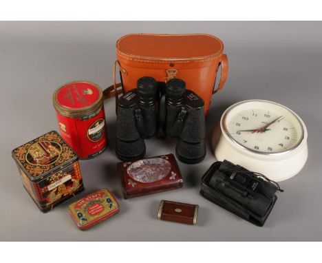 A quantity of collectables. Includes Zenith 10x50, Smiths wall clock, vintage tins etc.  