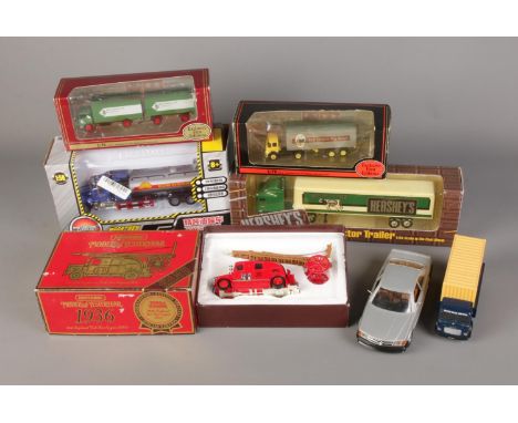 A quantity of diecast vehicles including boxed examples such as Matchbox 1936 Leyland Fire Engine, Hershey's Tractor Trailer 