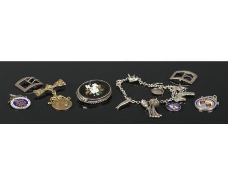 A collection of late nineteenth and early twentieth silver and white metal jewellery. To include silver belt buckles, enamel 