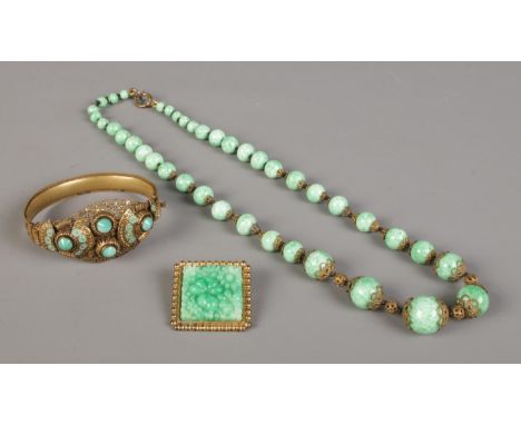 A small quantity of mid Twentieth century Peking Glass jewellery, comprising of necklace, bangle and brooch.  