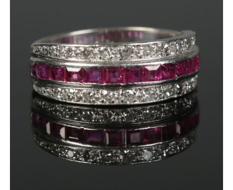 An 18ct White Gold channel set ruby and diamond ring. Size MÂ½. Total weight: 6.22g  