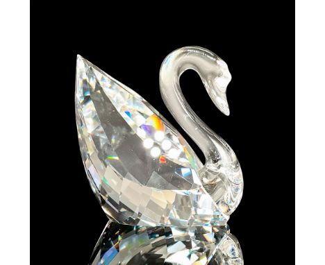 A sparkling faceted crystal figurine modeled as the classic Swarovski swan with a molded crystal neck. Swarovski acid mark to