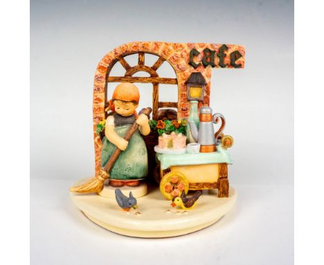 Hand painted in matte finish figure accompanied with display base titled 'Strudel Haus'. Depicts a little girl sweeping the f