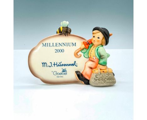 Porcelain display featuring Goebel Hummel's The Merry Wanderer, celebrating the Millennium in 2000. Goebel Germany backstamp.