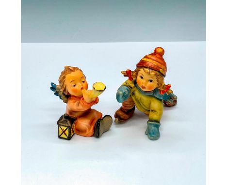 2 charming porcelain figurines, Tuneful Angel HUM359 and Skating Lesson HUM2058. Goebel backstamp. Largest piece measures 3.5