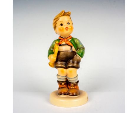 Hand painted porcelain figure. Boy holding a trumpet. Goebel Hummel backstamp. Artist: M.I. HummelIssued: 1960-1972Dimensions