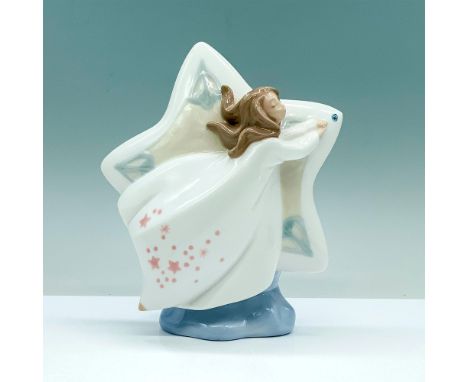 A glazed figure depicting a star with a floating woman in a white dress passing the center of the star. Nao by Lladro backsta