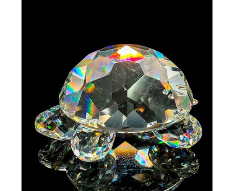 Eye-catching clear faceted figure of a turtle with round legs and green crystal eyes. Swarovski acid etched mark. This item h