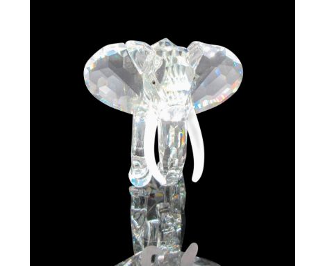 Beautiful 1993 figural has clear crystal body, satin tusk and black inset crystal eyes. Swarovski backstamp. This item has it